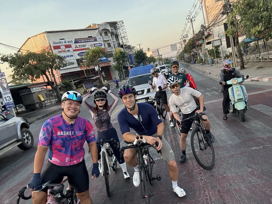 A social cycling club posing with their bikes